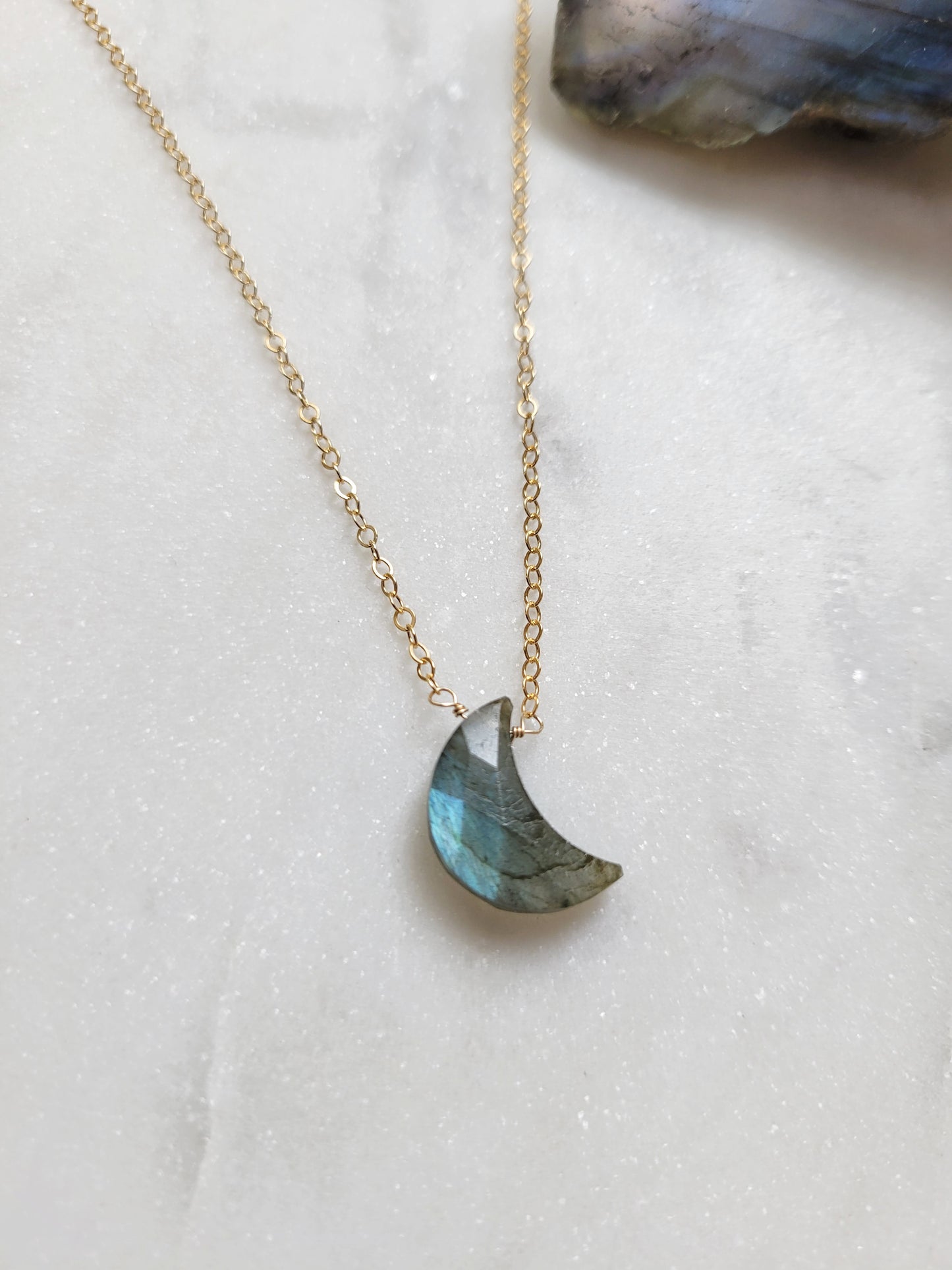 Upside down sterling crescent moon pendant with faceted labradorite